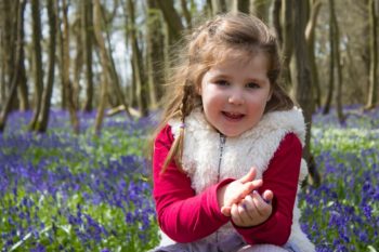 Girl explores woodland