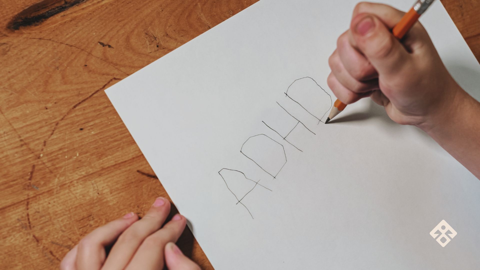 ADHD Symptoms in Children written by a child on a piece of paper — highlighting early signs and deeper causes often missed in mainstream narratives.